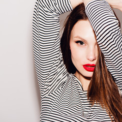 Close-up portrait of beautiful woman with bright makeup
