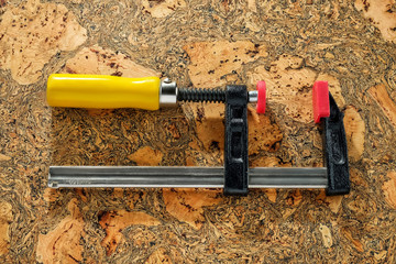 C Clamp, C Clamp lock on wooden background, Mechanic concept