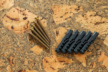 Dowel-nail, perforator and electric screwdriver on the table