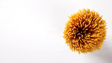 Spagetti Dry Pasta made from durum  on White Background.Copy space for Text. selective focus.