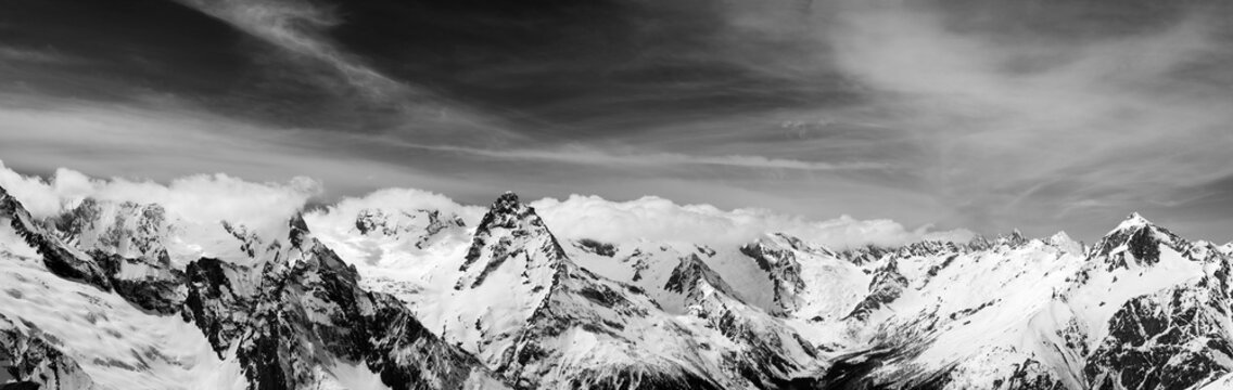 Black and white panorama of snow winter mountain