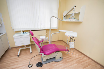 Modern dental office. Dental chair and other accessories used by dentists.