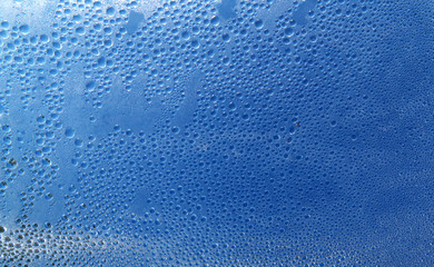 fused bubbles on the plastic film against the backdrop of blue sky