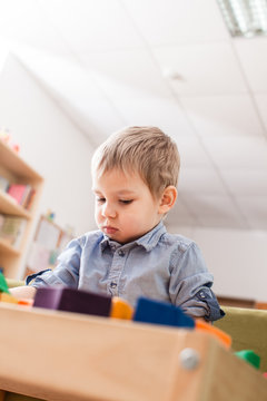 Boy playing with cubes