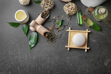 Spa composition with tea tree oil on gray background