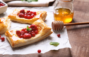 Delicious pastries on food paper, closeup