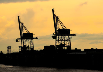 Fototapeta premium Wharf cranes at dusk