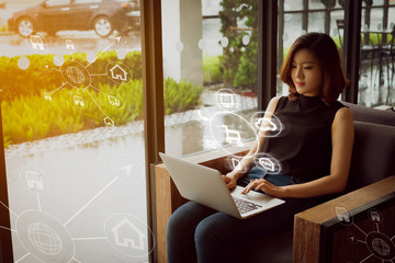 Woman using laptop payments online shopping and icon customer network connection on screen, m-banking and connecting with omni channel vendor. Internet of thing, Multi-channel or Omni channel concept.