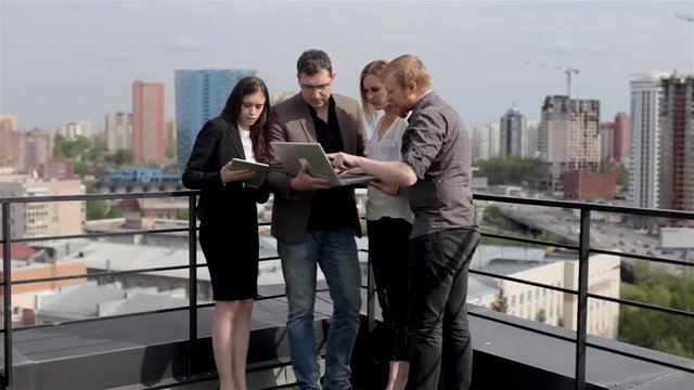 Group of Designers, Architects Discuss a Business Project on the Roof of the House