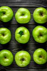 ripe green apples dark wooden table background top view pattern
