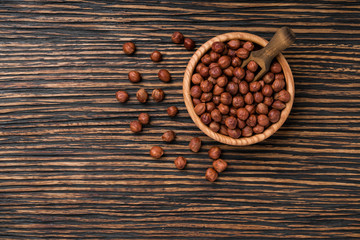 hazelnut on a brown wooden table,top view