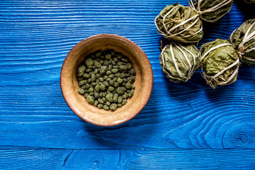 Different kinds of herbal tea on blue background top view