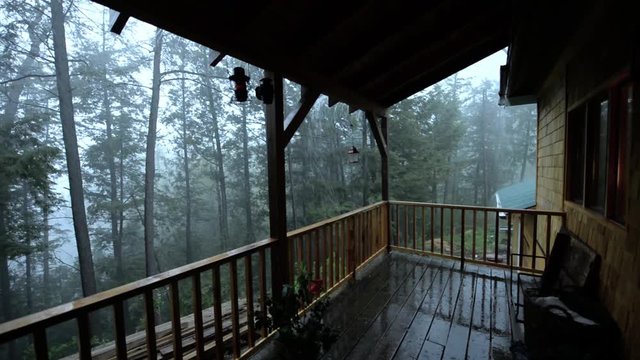 Extreme rain storm view from deck of a house