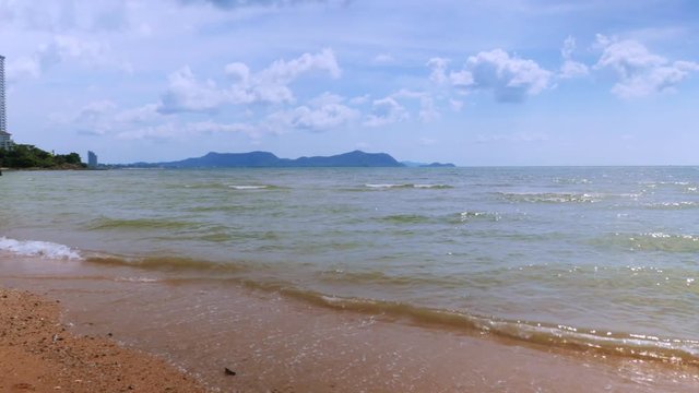 Beach with bright sky The sea is calm in nature, suitable for vacation or beach activities. Beautiful landscape view and this scene was taken at a public beach at Haad Baan Amphur, Chon Buri, Thailand