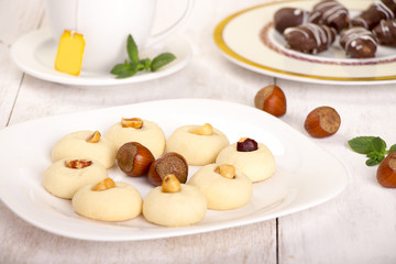 Ghorayeba -  Butter Cookies with nuts and cup of tea for Eid El Fitr - Islamic Feast