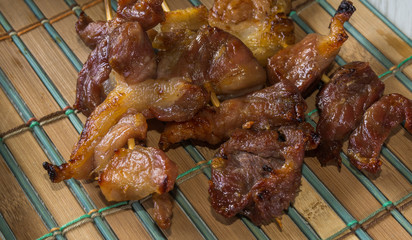 Fried pork eat with hot cooked rice on wooden background.