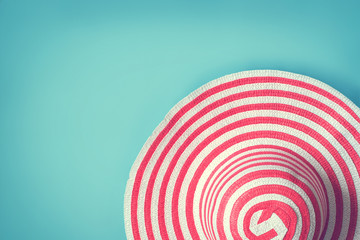 Women's striped summer romantic hat for beach holiday. Top view with copy space, Toned