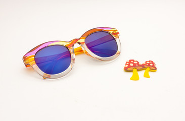 CREATIVE SHOOT OF SUNGLASSES WITH COLOURFUL BACKGROUNDS AND COOL PROPS