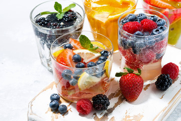 carbonated drinks with berries and fruits, closeup