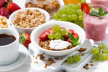 delicious and healthy breakfast with fruits, granola and milkshake