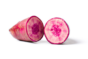 Raw purple potato isolated on white