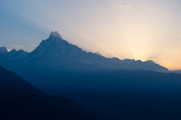Silhouette of Machapuchre (Fish tail) mountain peak in a morning sunrise, Annapurna trek, Pokhara, Nepal