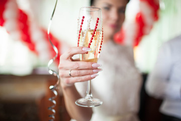 the bride holds the wedding glass