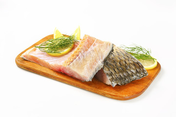 Raw carp fillets