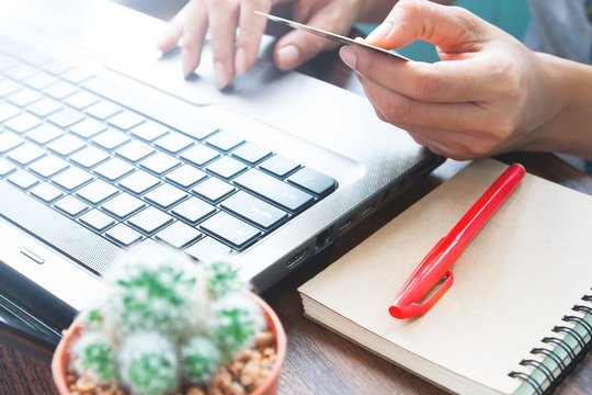 Business and shopping on line with credit card, Woman hands using laptop and credit card