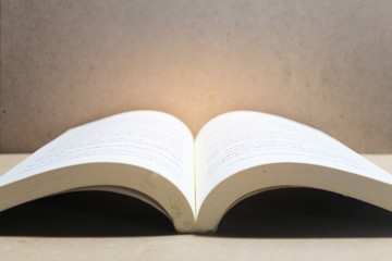 Open book on the wood table