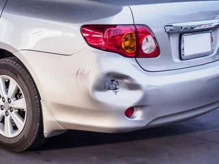 Deurstickers car has dented rear bumper damaged after accident © Piman Khrutmuang