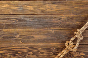 Rope knot on wooden board