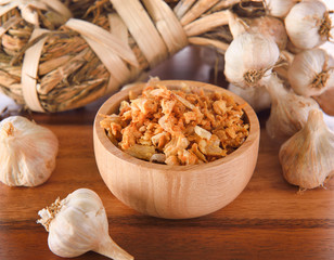 fried garlic on wooden bowl