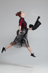 young girl in the studio isolated on gray