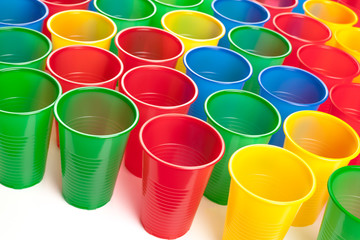 Multicolor plastic glasses isolated on white background