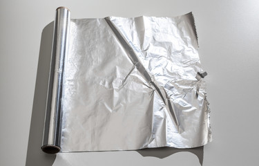 roll of aluminum foil isolated on white background
