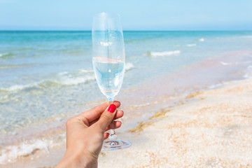 Glass of wine on beach