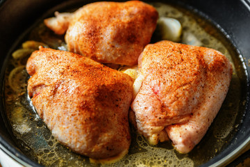 Chicken on frying pan