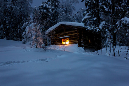 A Secluded Hut Deep In The Winter Forest