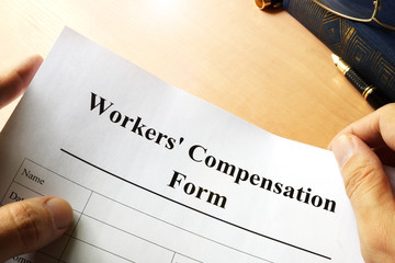 Workers compensation form on a table.