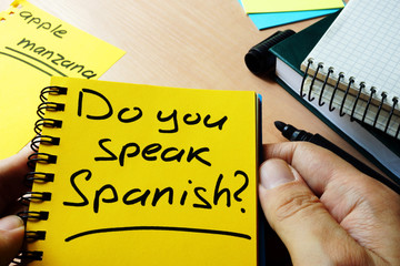 Do you speak Spanish? written in a note.