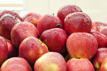 Group of red apples with water drops