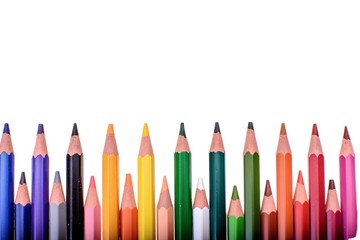 Many colored pencils isolated on white background, place for text
