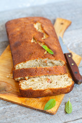Pieces of banana bread on a wooden board. Love for a healthy vegan food concept
