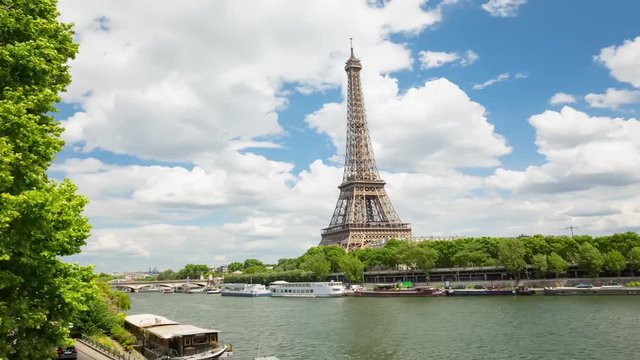 A timelapse of the Eiffel Tower and Pont d'I na along the river Seine with flyboats. Timelapse, 4K.