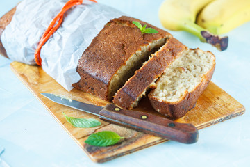 Pieces of banana bread on a wooden board. Love for a healthy vegan food concept