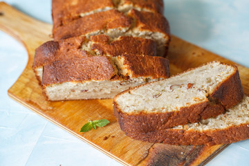 Pieces of banana bread on a wooden board. Love for a healthy vegan food concept
