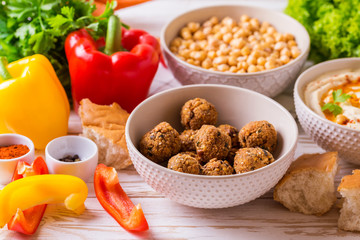Falafel, pita, hummus and chickpea  with vegetables. horizontal view
