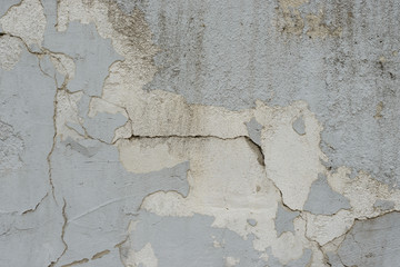 Wall fragment with scratches and cracks