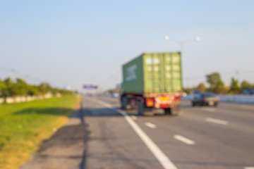 Obraz premium Abstract blurred image of Truck on road. Cargo transportation.